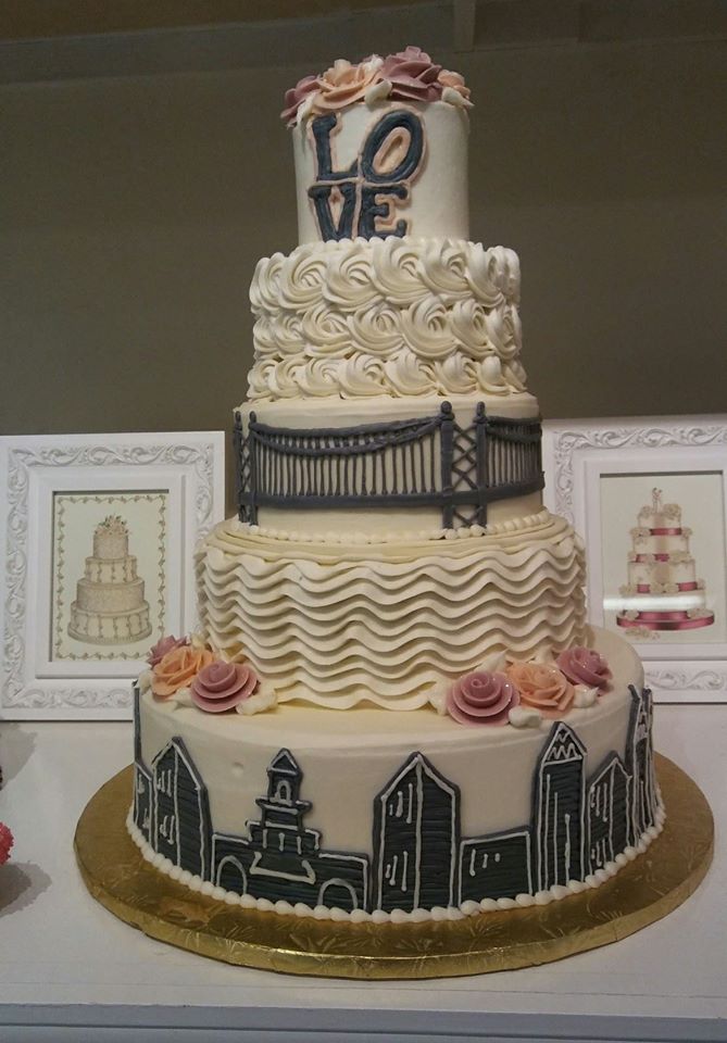 A wedding cake with the word love on it.
