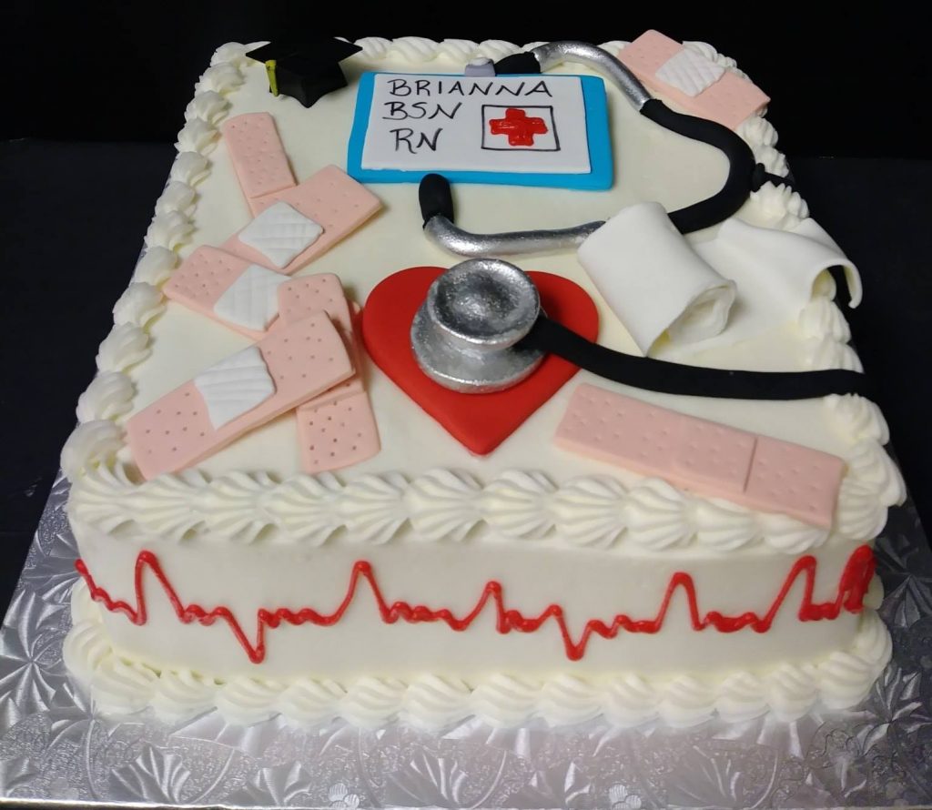 A cake decorated with a stethoscope and heartbeat.